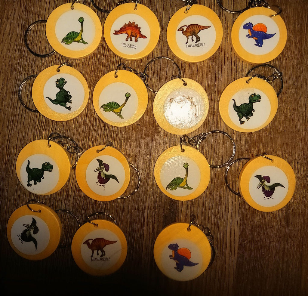  1 inch wooden double sided keyrings featuring dinosaurs